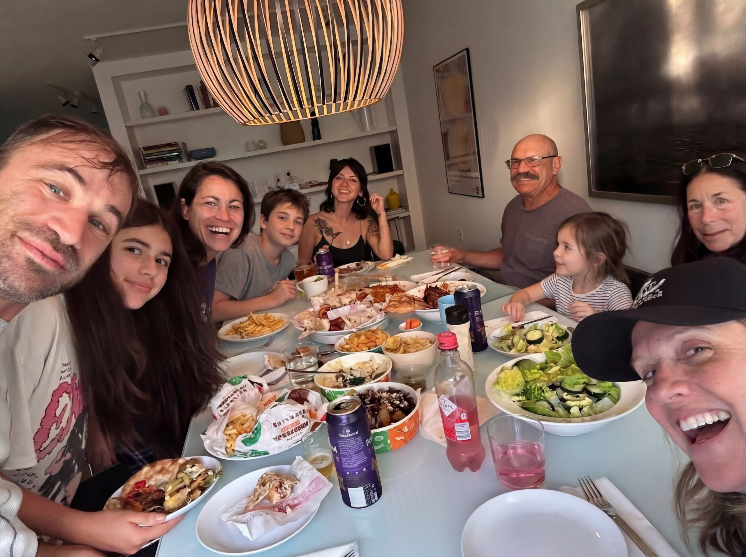 Families sharing a meal together around a table